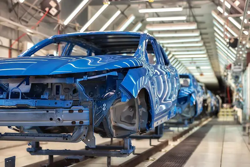 Car bodies on manufacturing line